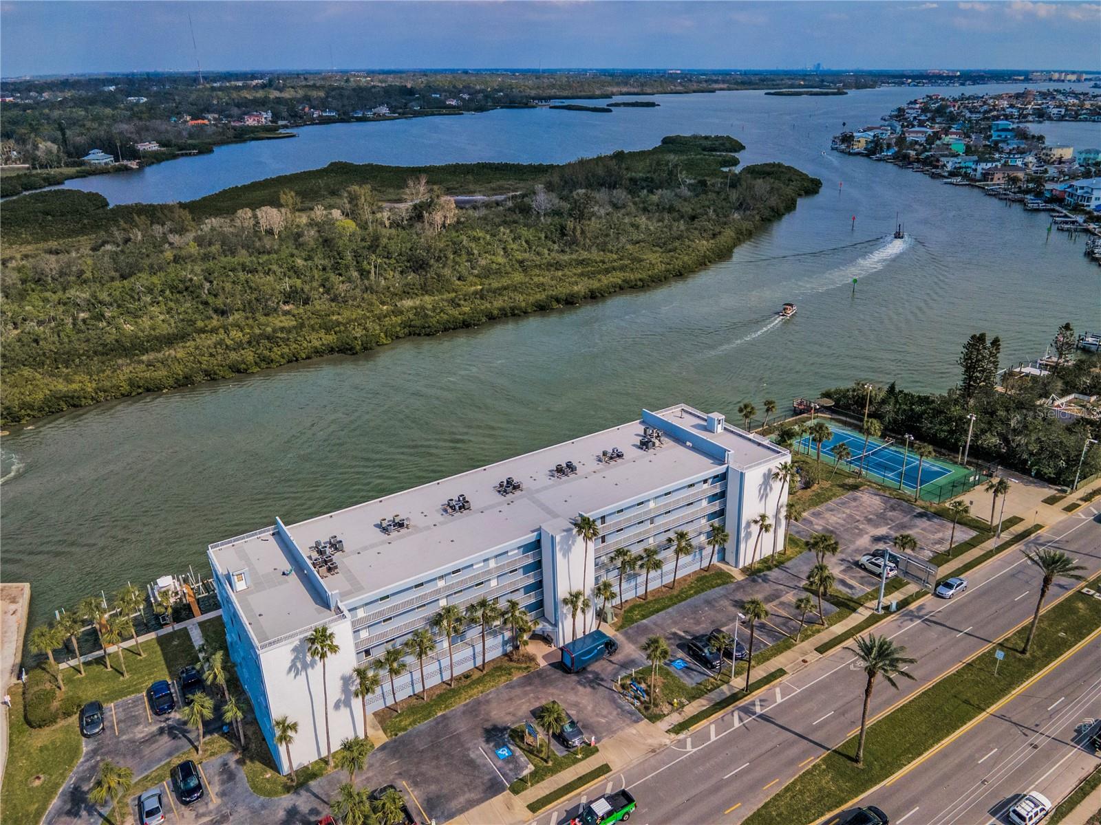 Direct waterfront & across the street from the sugary sands of the Gulf!