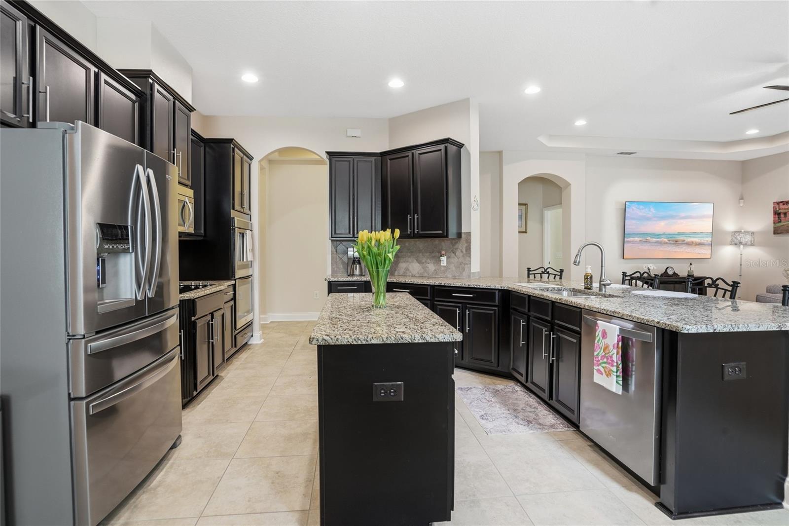 stinless, granite and beautiful cabinetry