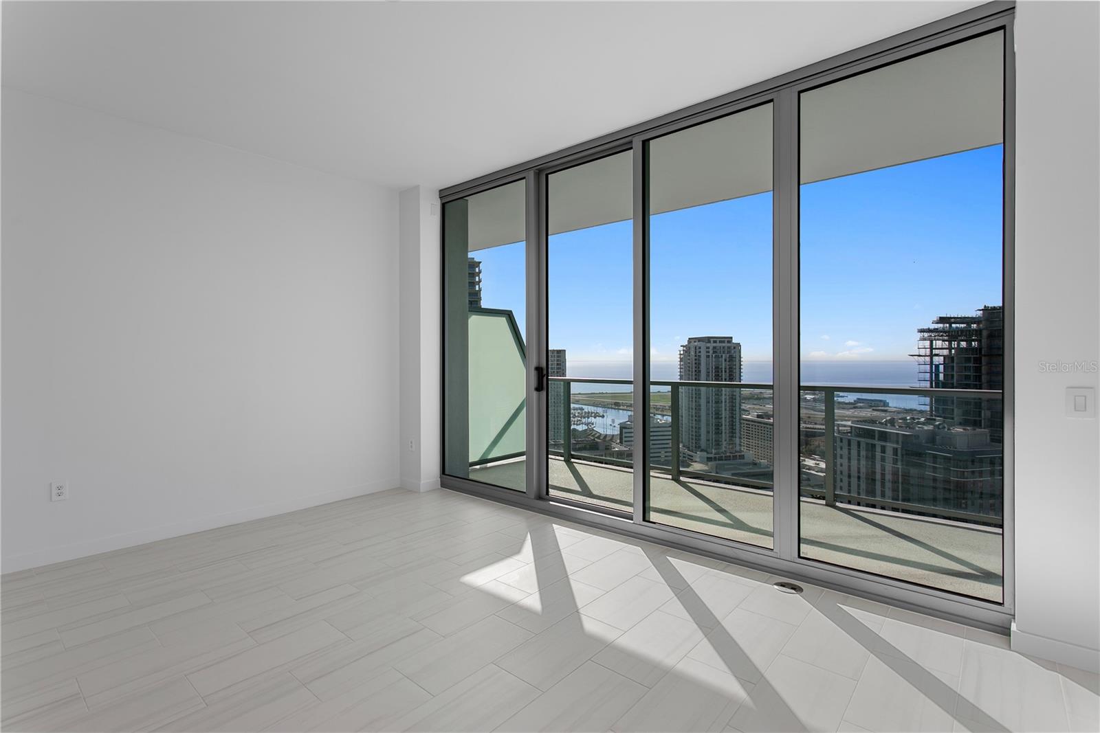 Primary Bedroom with En-Suite and walk-in closet. Sunrise Views!