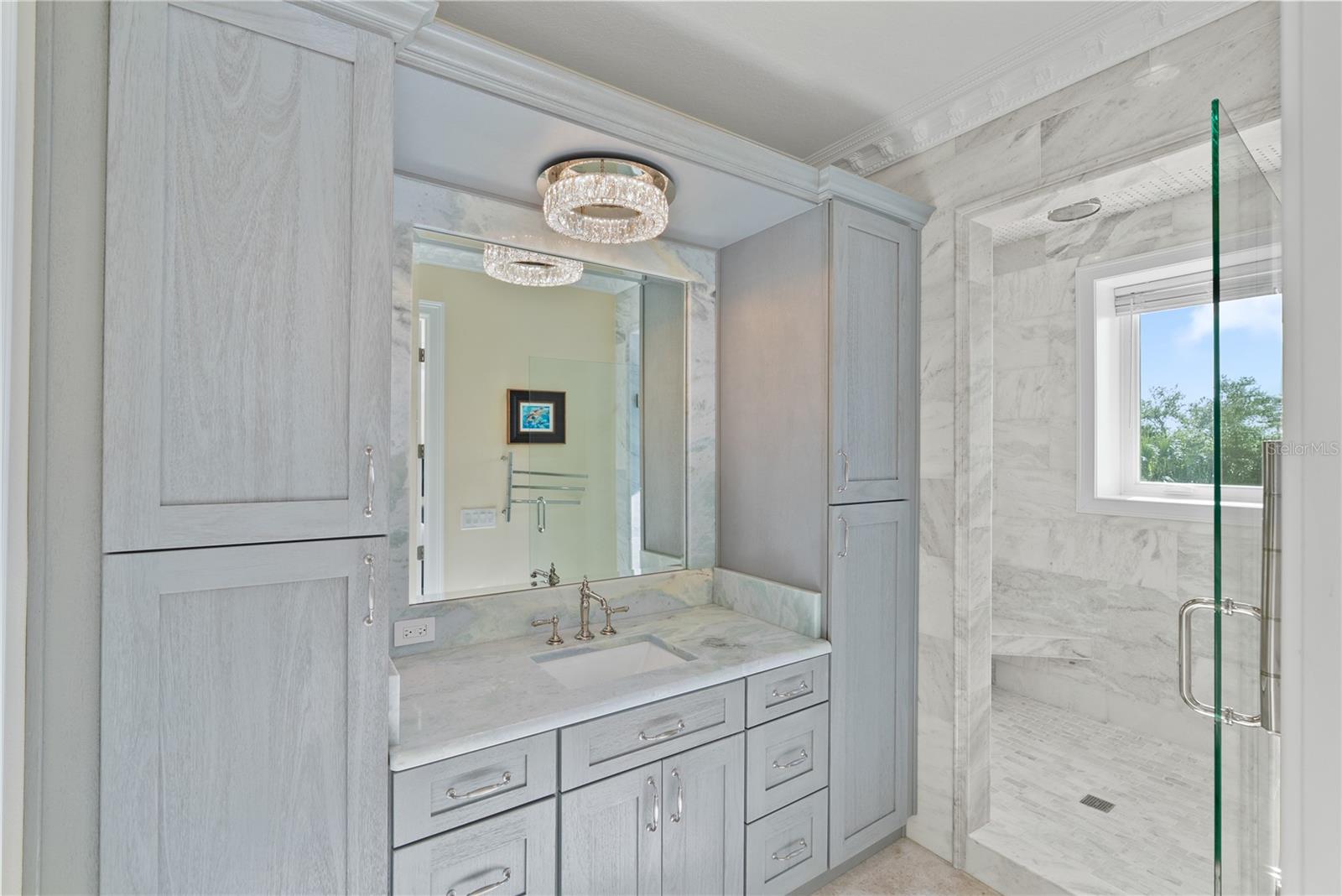 Elegant marble bath with refined finishes and spa-inspired design.