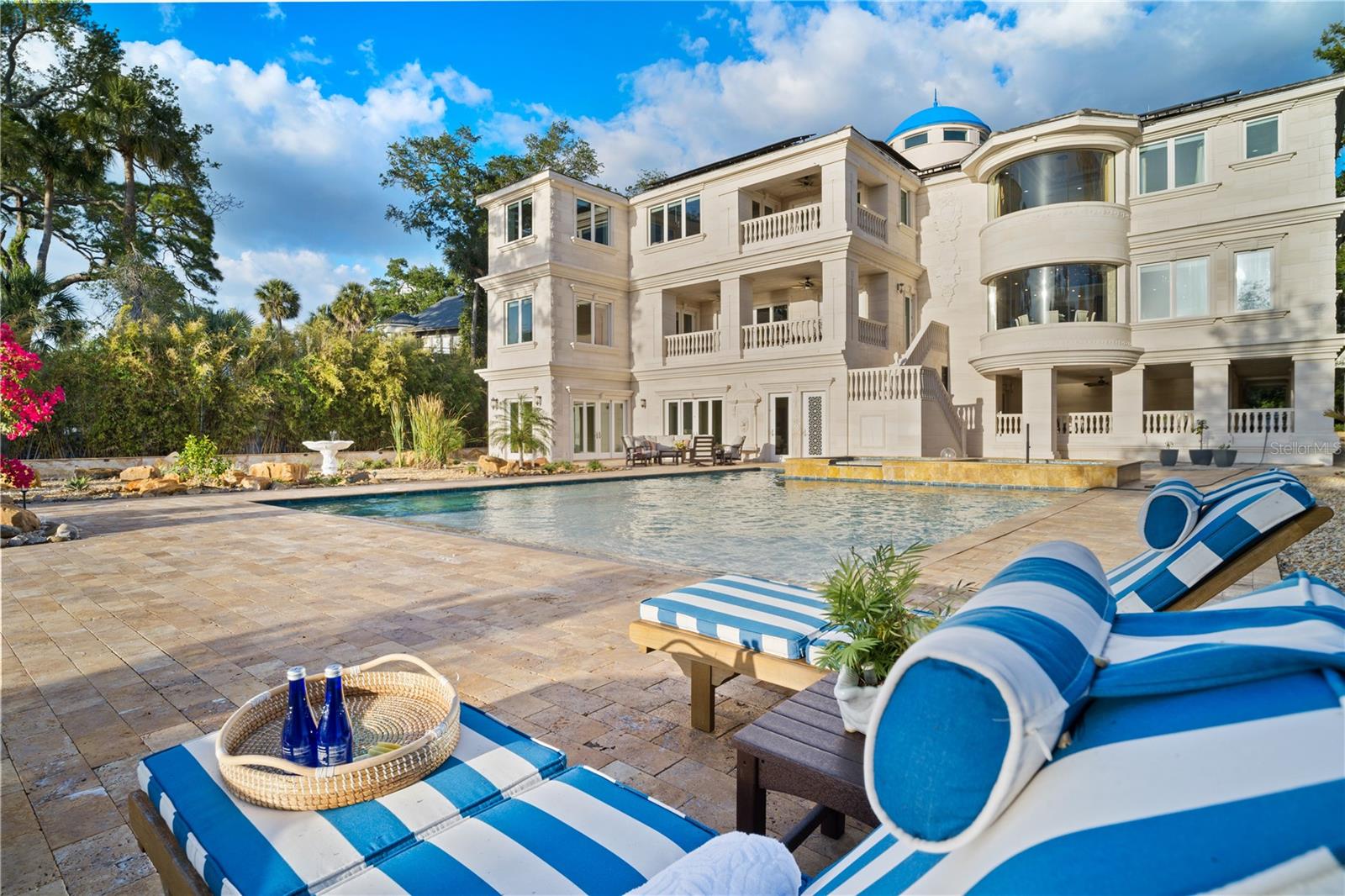 Relax poolside on your expansive grounds, where resort-style living meets total privacy.