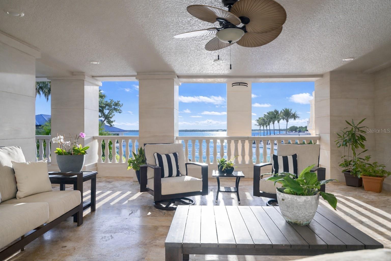 Covered terrace offering shade, breeze, and stunning water vistas.