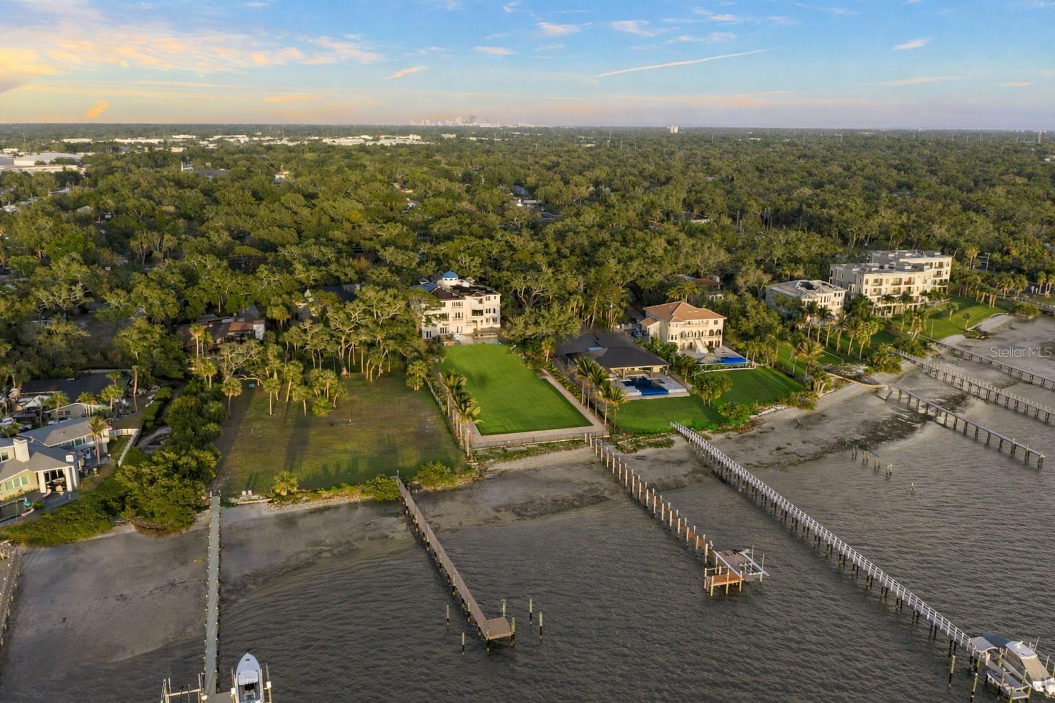 Expansive waterfront estate with direct access to open water. Over a half-acre of backyard lawn -  waterfront grounds with endless possibilities.