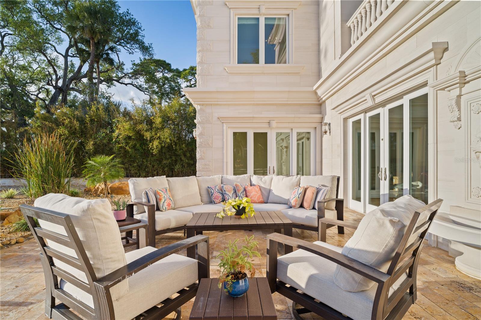 Private patio surrounded by lush landscaping and serene views.