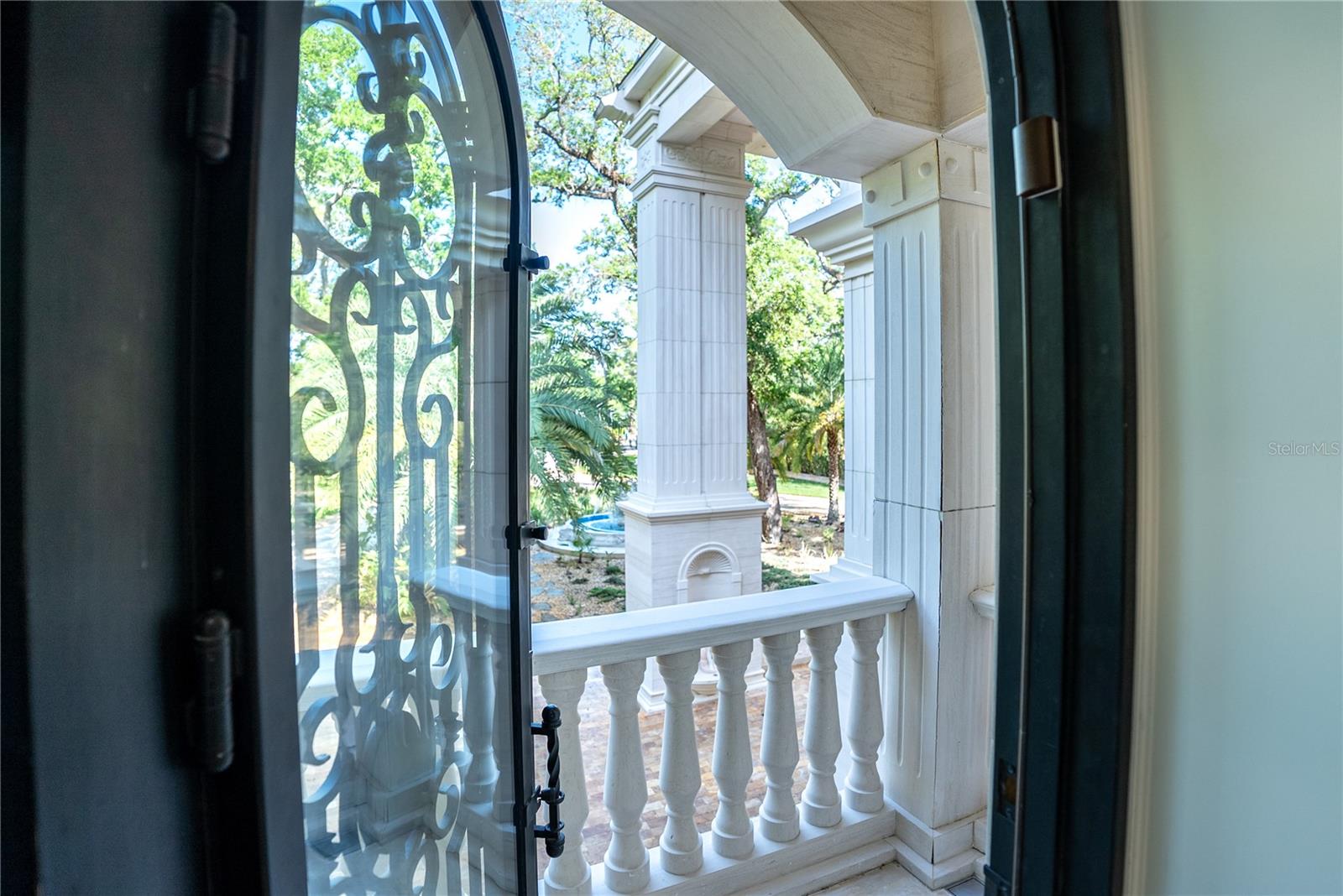 Spa-inspired marble bath with sauna, soaking tub, and custom detailing.