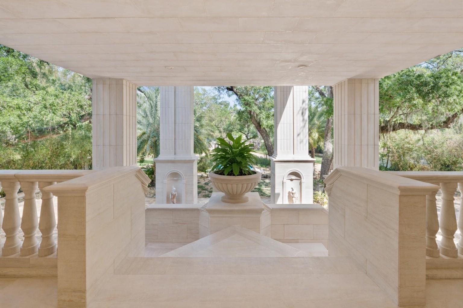 Museum-inspired design with illuminated niches and architectural detailing.