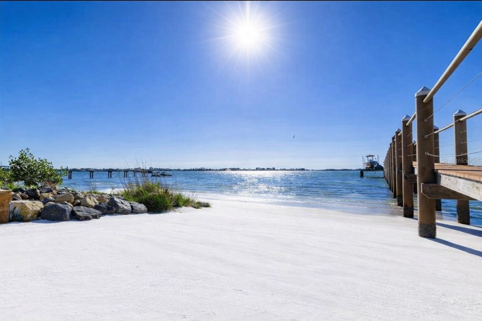 Private beach, no seawall. includes a 10,000-lb boat lift with a built in area for two Jet skis, wet slip for a yacht, and direct Gulf access.