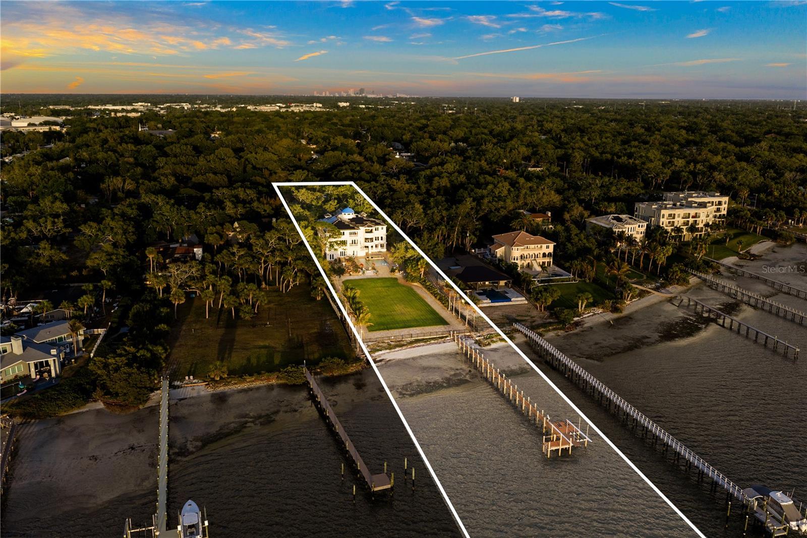 Expansive lawn ideal for recreation (pickleball courts, basketball, boathouse, additional dwelling unit, greenhouse, entertaining, or future enhancements.