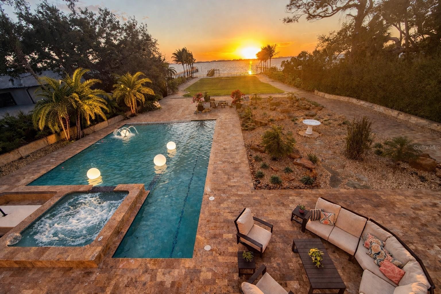 Unforgettable sunset views from your private waterfront estate on over 1.5 acres.Private waterfront living with sunset views over Boca Ciega Bay.