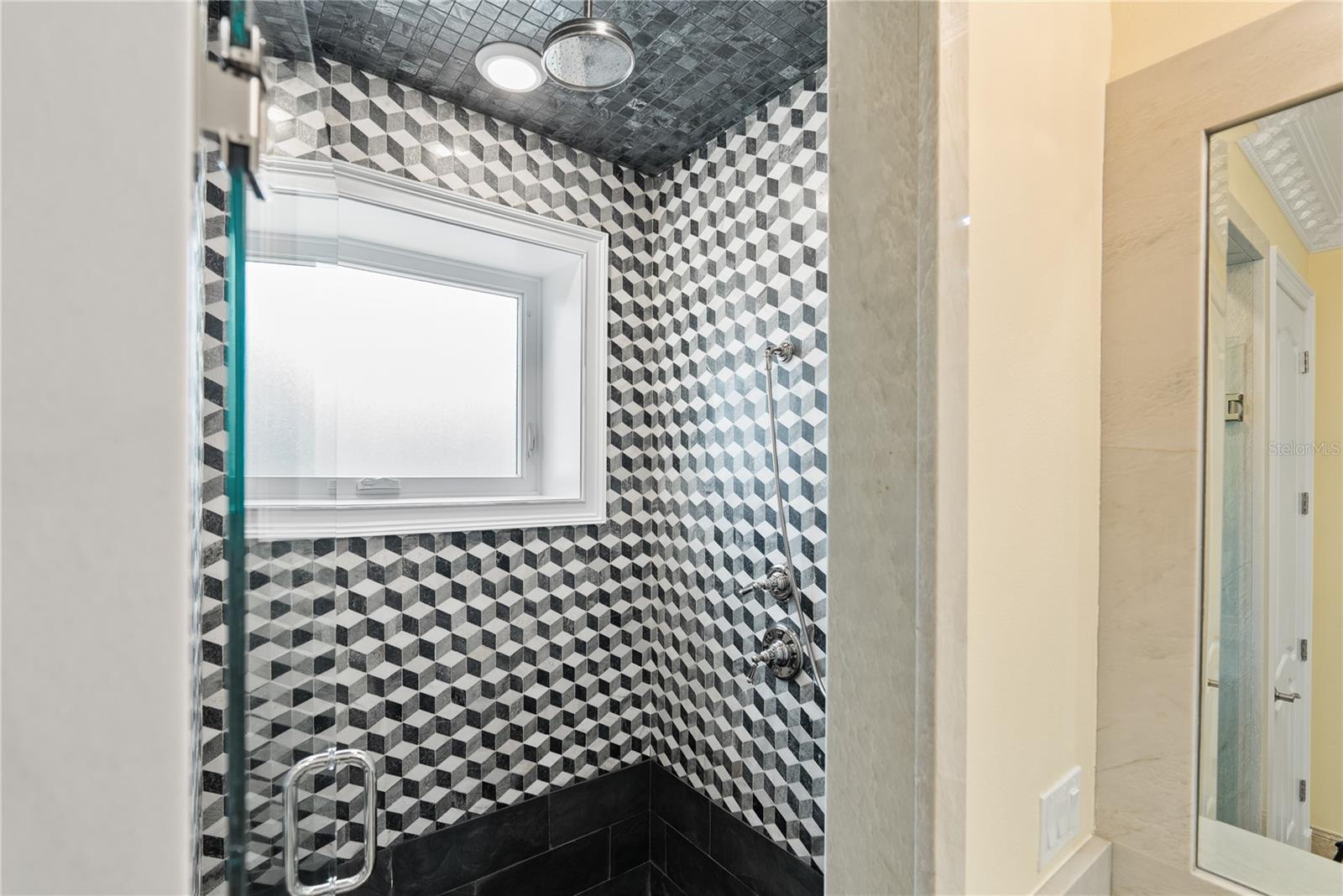 Bathroom # 4 with a modern inlaid marble.