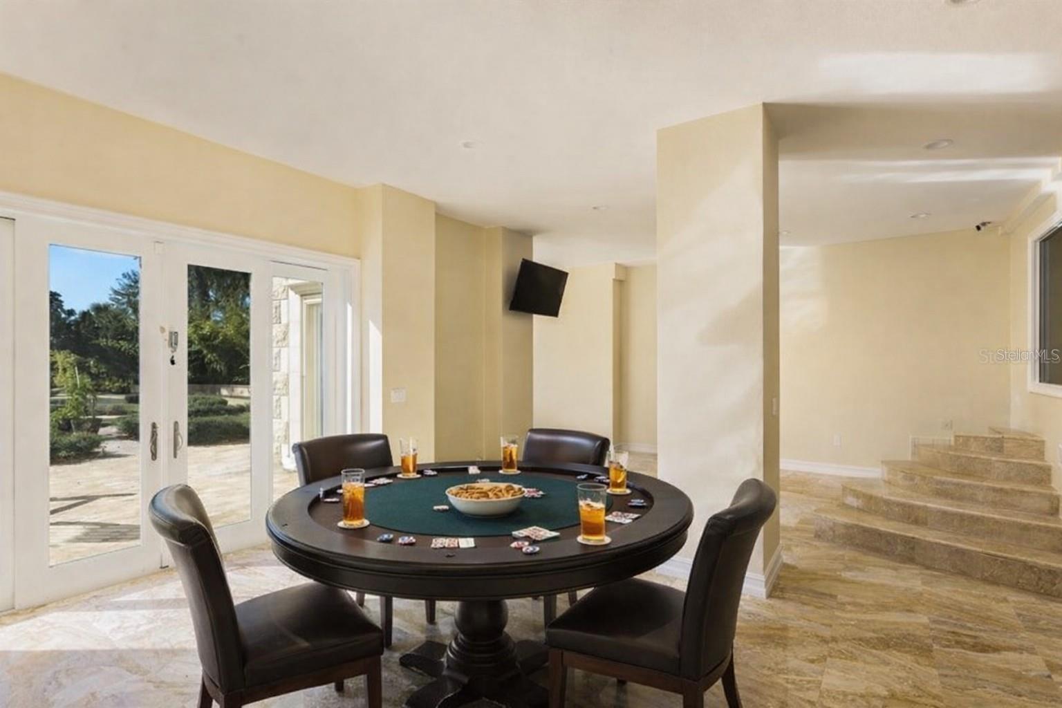 Versatile lower-level space ideal for entertaining or recreation.