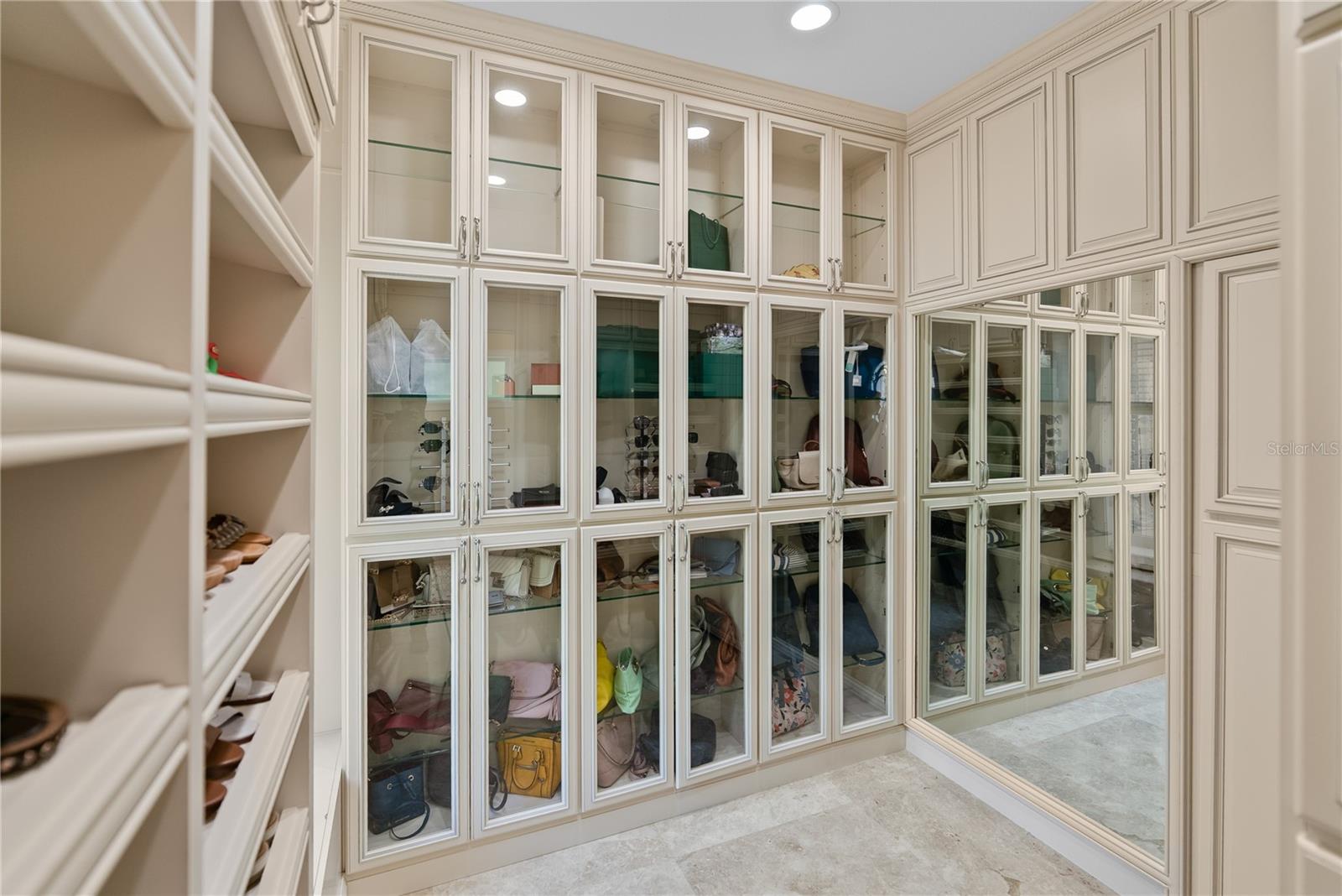 Glass enclosure for your shoe and purse collection.