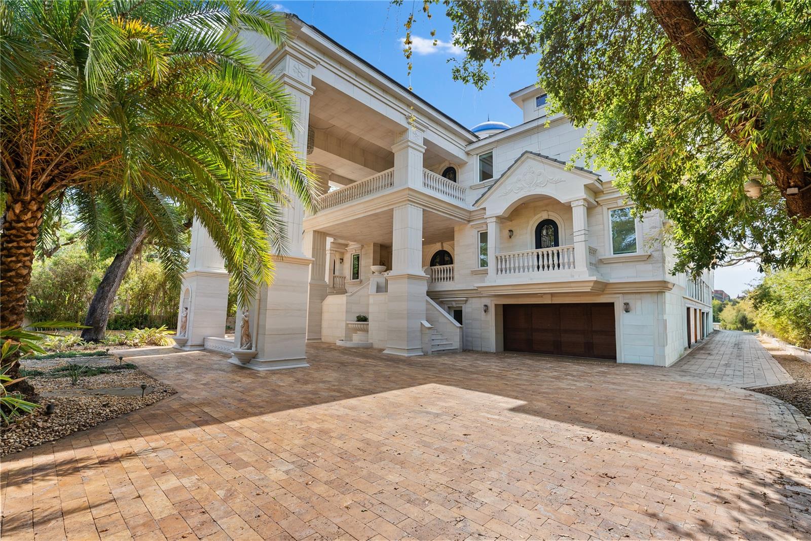 Grand estate façade with timeless architecture and expansive motor court.