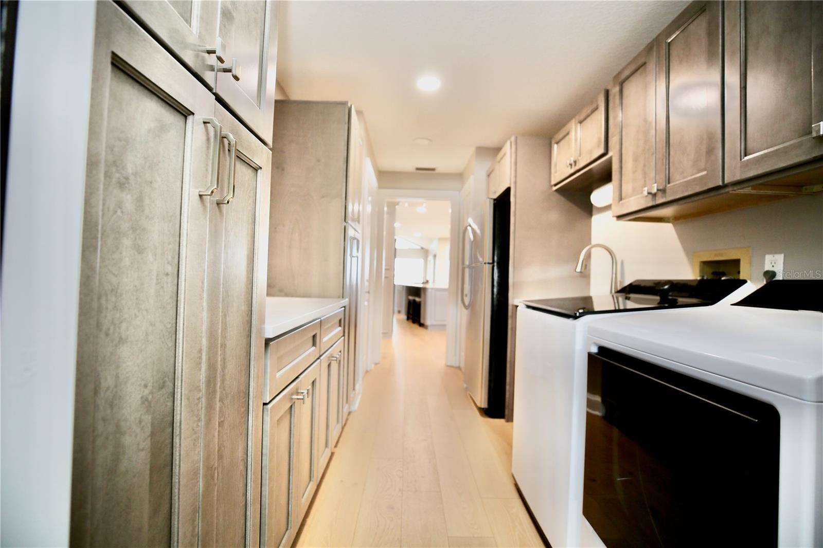 Extra storage, laundry room and washer and dryer to convey