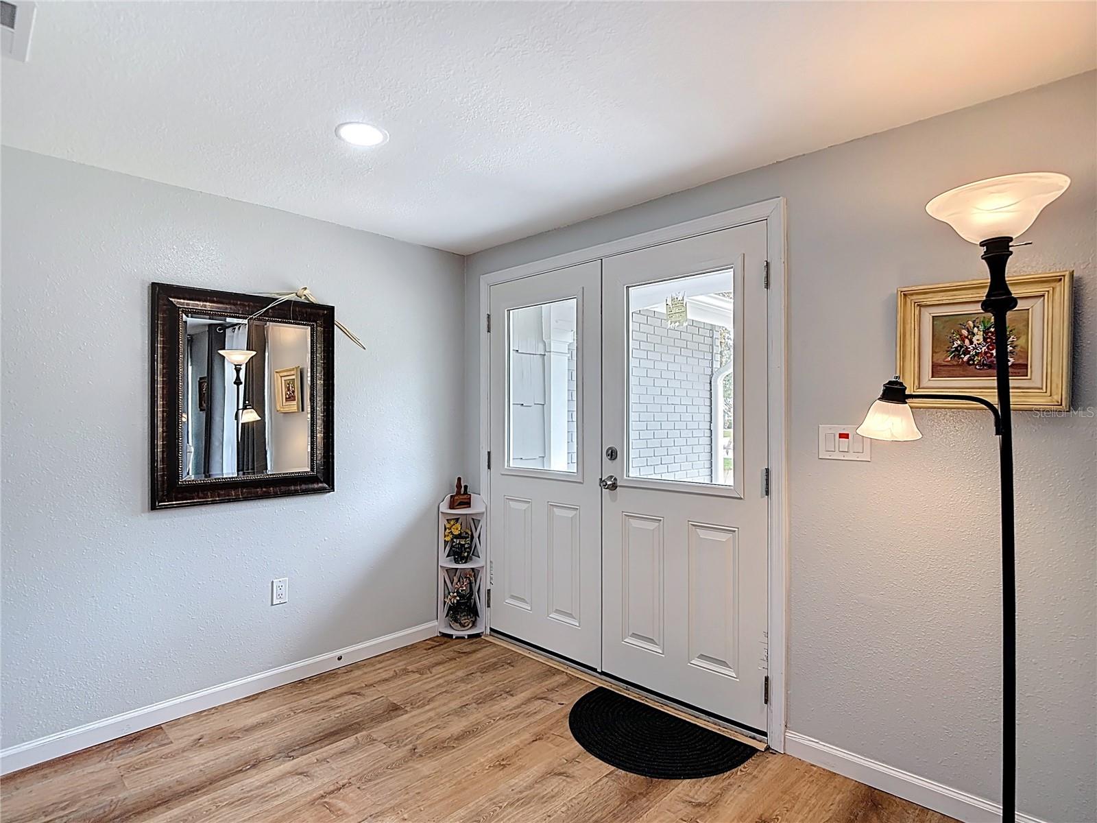Foyer with a new hurricane rated entry door replaced in 2024-2025.