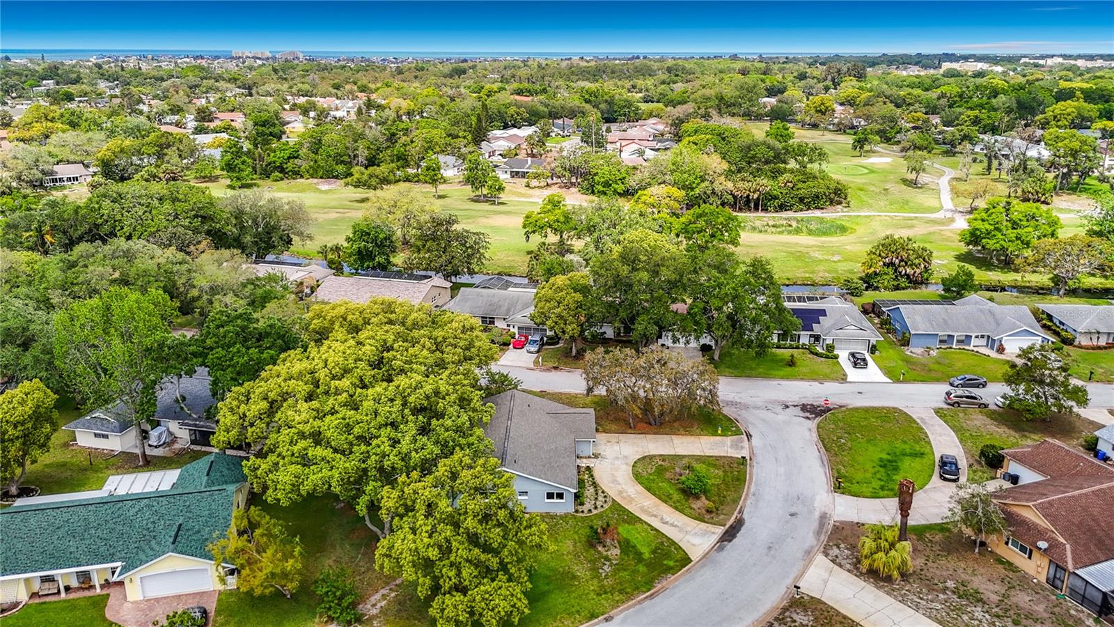 Aerial View of the home and back drop of the golf course