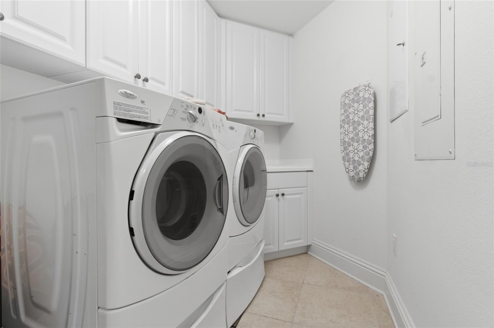 Large laundry room inside the unit with washer and dryer included.