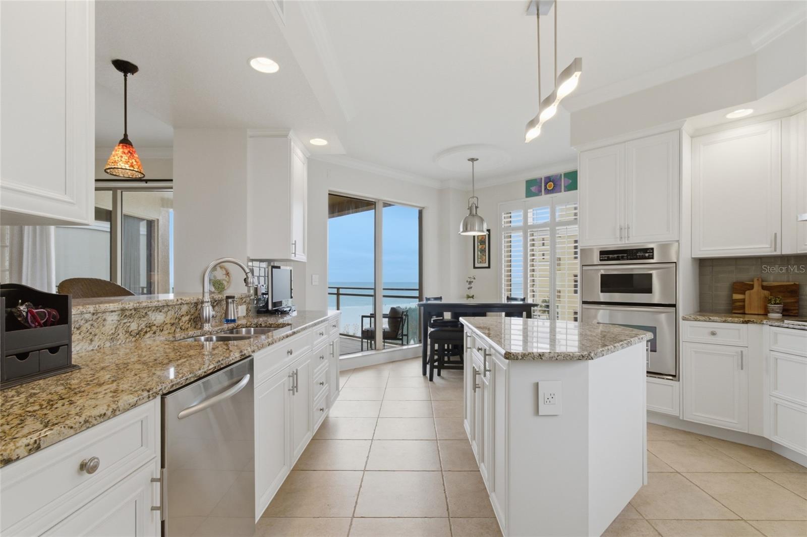 Plenty of room for island, kitchen table, and also barstools.