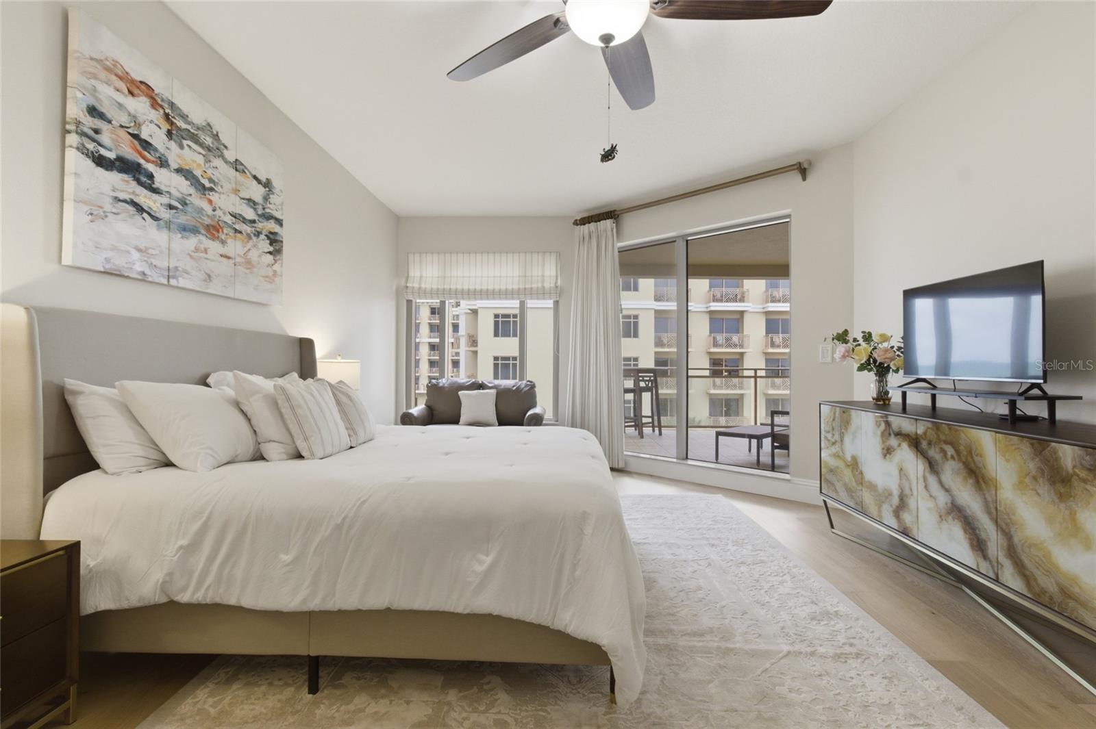 Primary bedroom has sliders to private balcony.