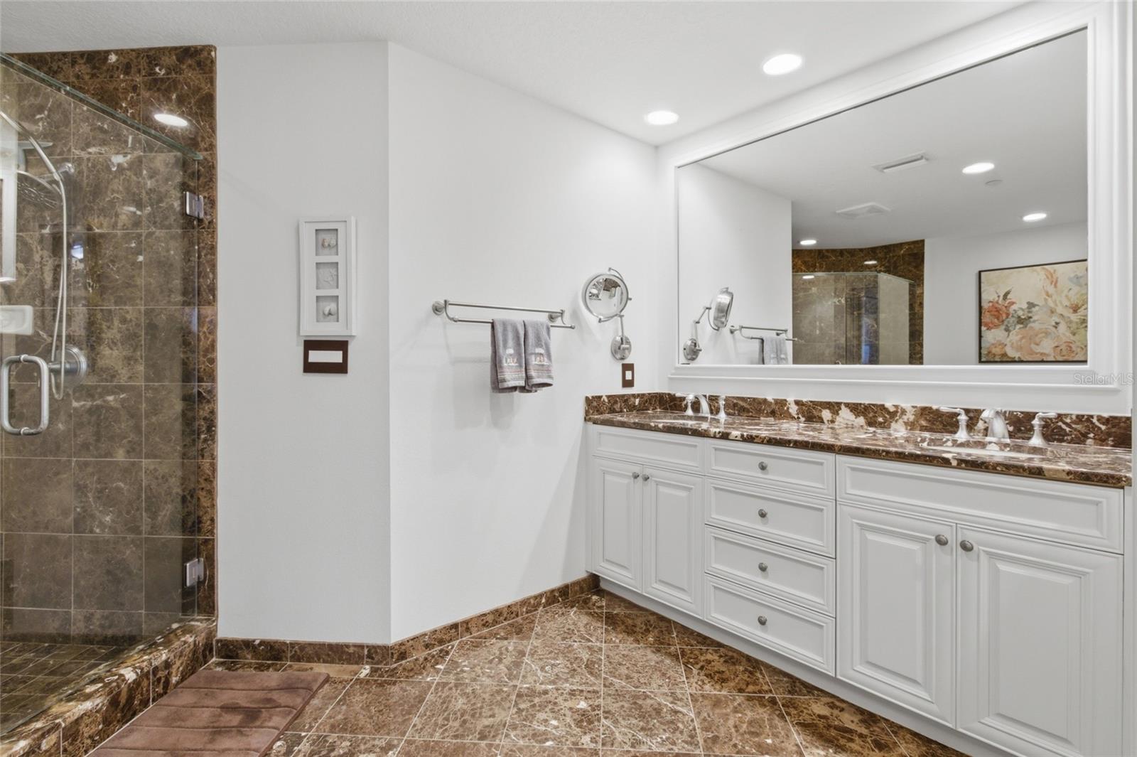 Primary bathroom provides double vanity.
