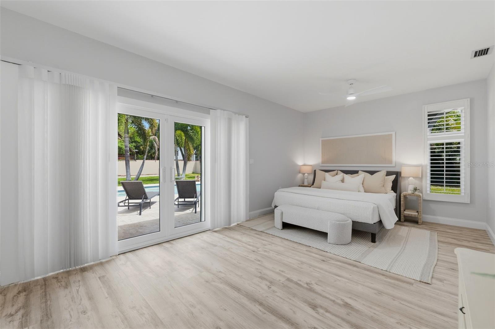 Primary Suite with Sliders to the Heated Salt Water Pool