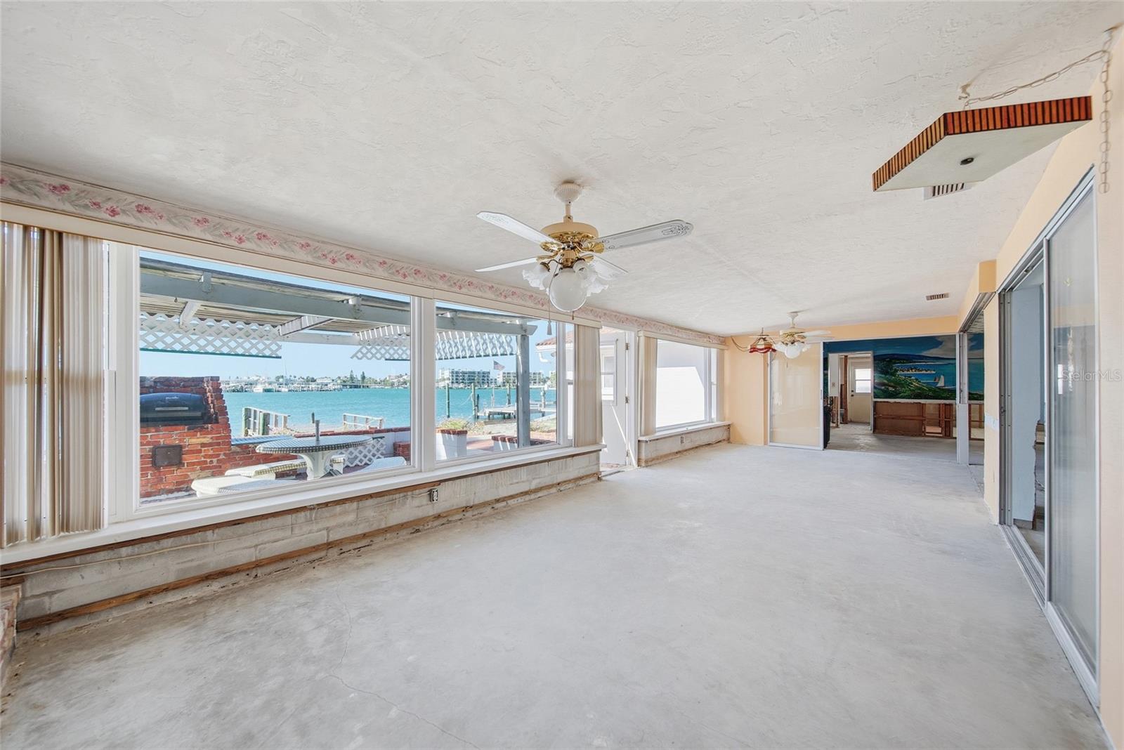 View from family room looking south towards the turquoise waters of the Intracoastal.  The existing kitchen area, living room, dining room, family room and 2nd bedroom have Intracoastal water views.