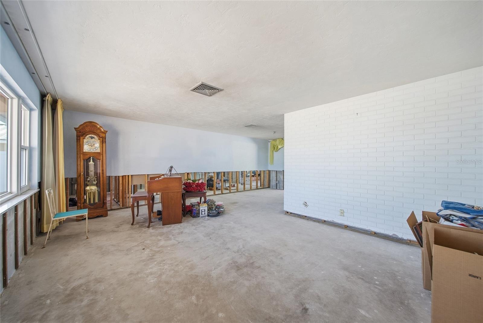 Living room in in the front of the home to the right of an entry foyer.