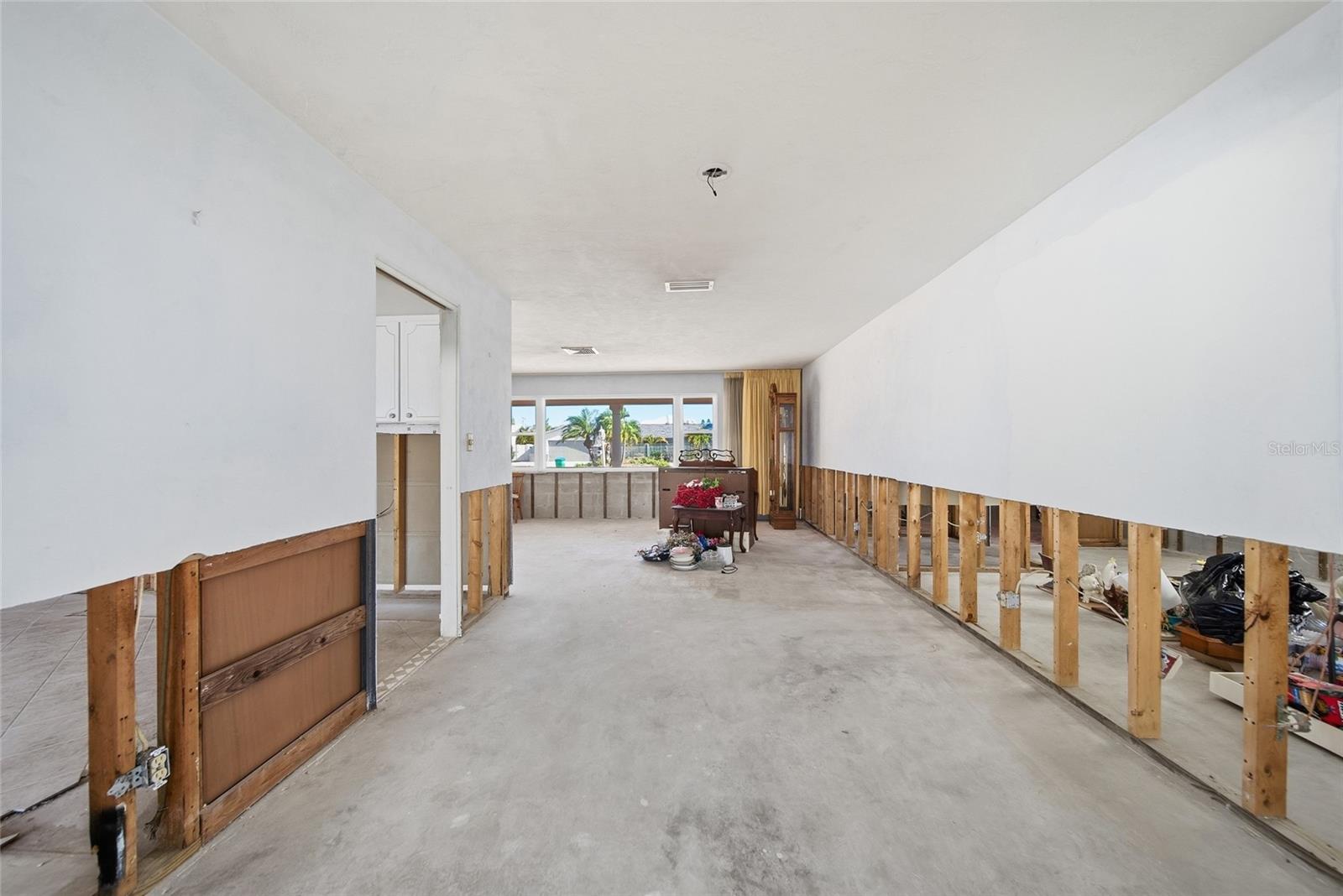 Extention of living room leading back to the family room.