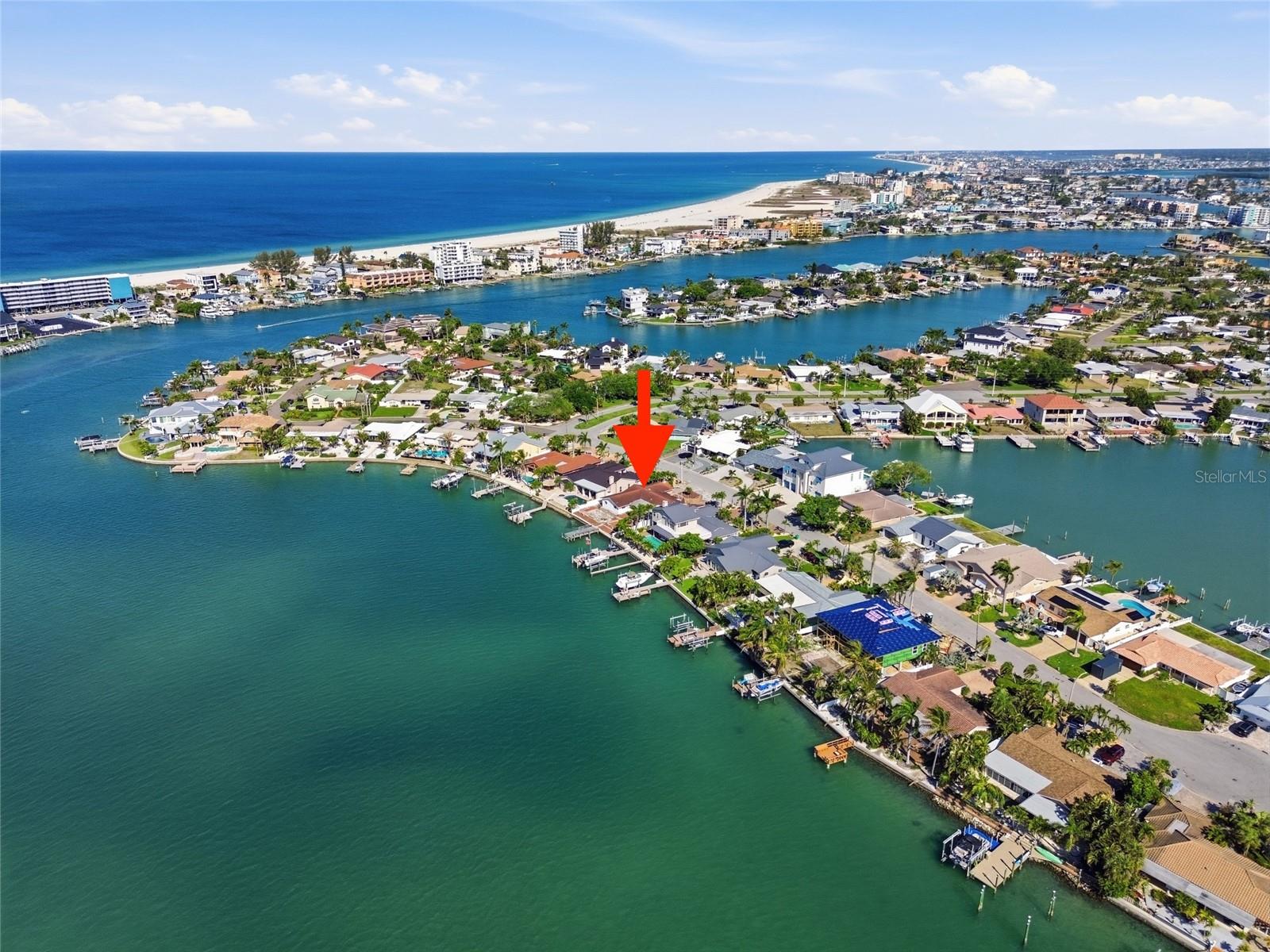 Drone view indicating 4 Bellevue Drive with the Intracoastal and Devil's Elbow on the left and the Gulf waters and beaches to the west above.
