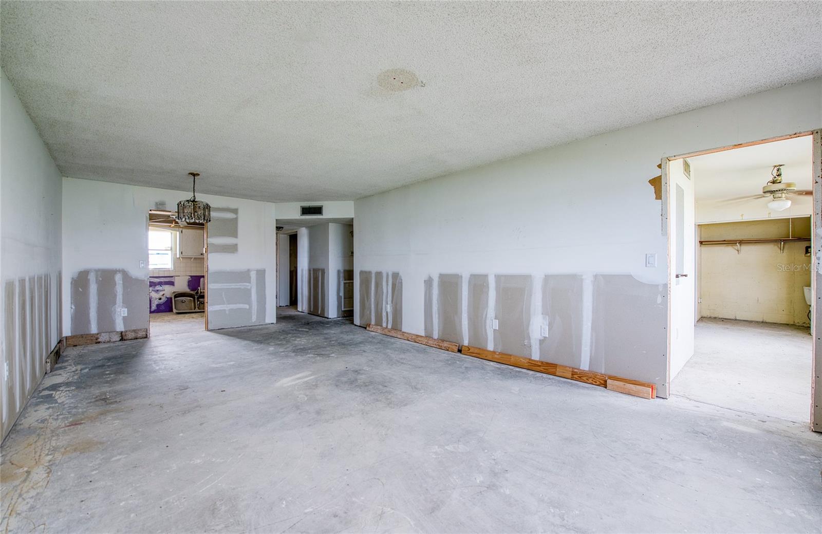 Kitchen, entry way, hallway to 2nd bedroom and bath, living room opens to Florida room