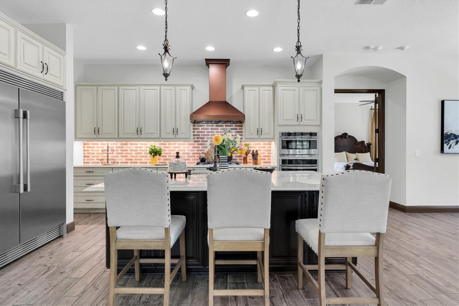 HAVE A SEAT AT THE EXTENDED ISLAND W/ KNEE WALL CABINETS