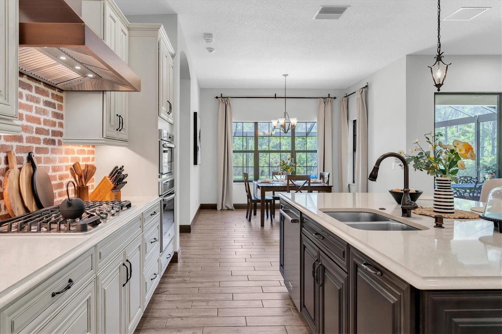 GLEAMING QUARTZ COUNTERS ILLUMINATED BY UNDER CABINET LIGHTS