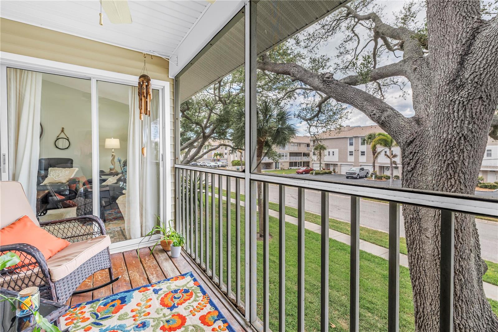 Enclosed screened balcony on second floor off of master bedroom