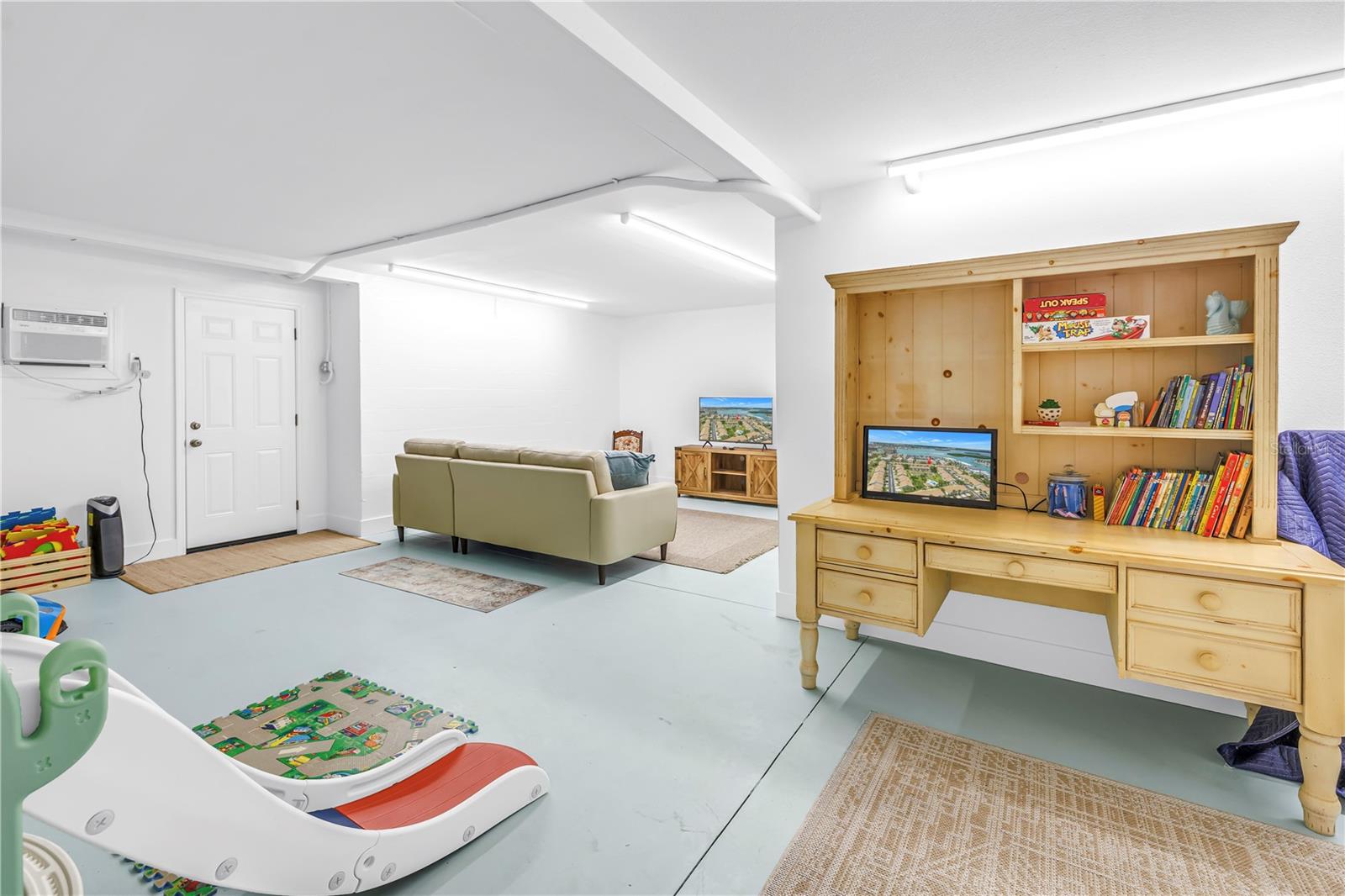 Finished bonus room added to the garage level with new dry wall which includes a bathroom toilet, sink and closet Also has enclosed garage space for your vehicle