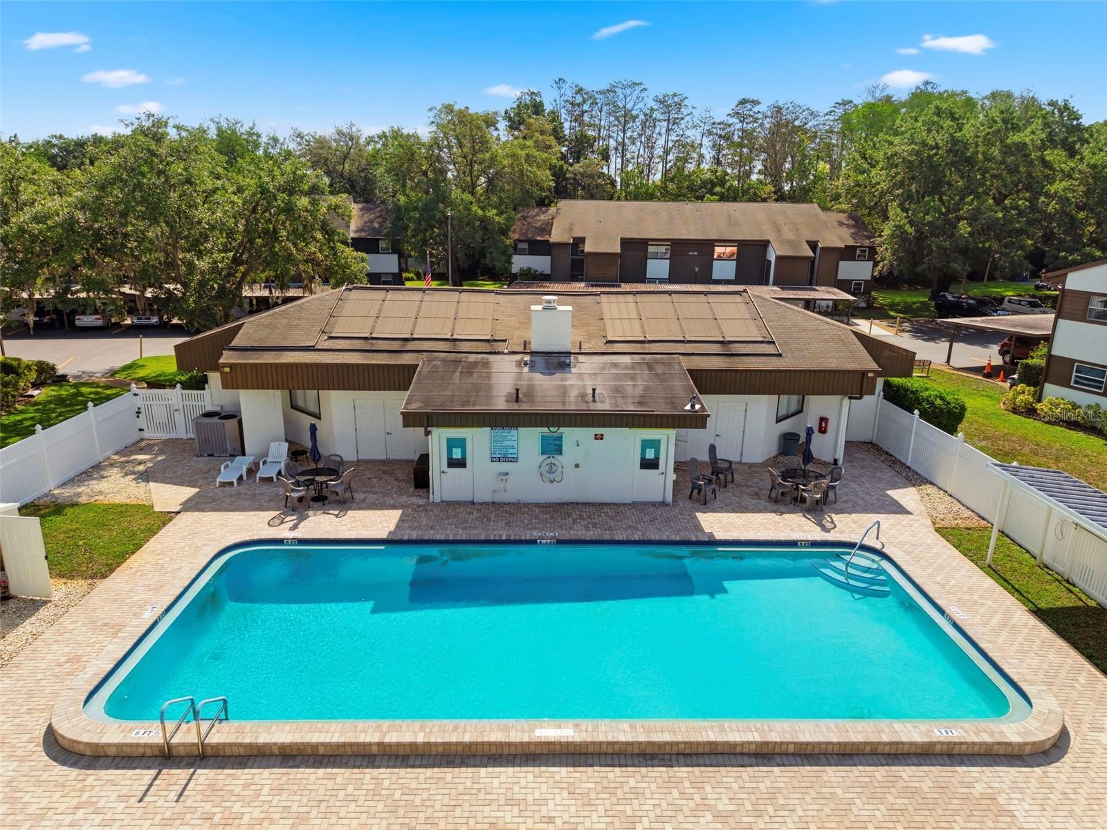 The community pool is next to your condo unit.