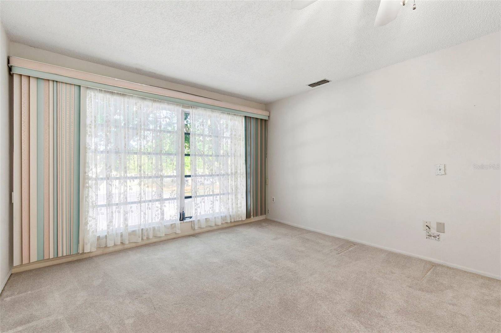 Big bay window at the end of the living room.