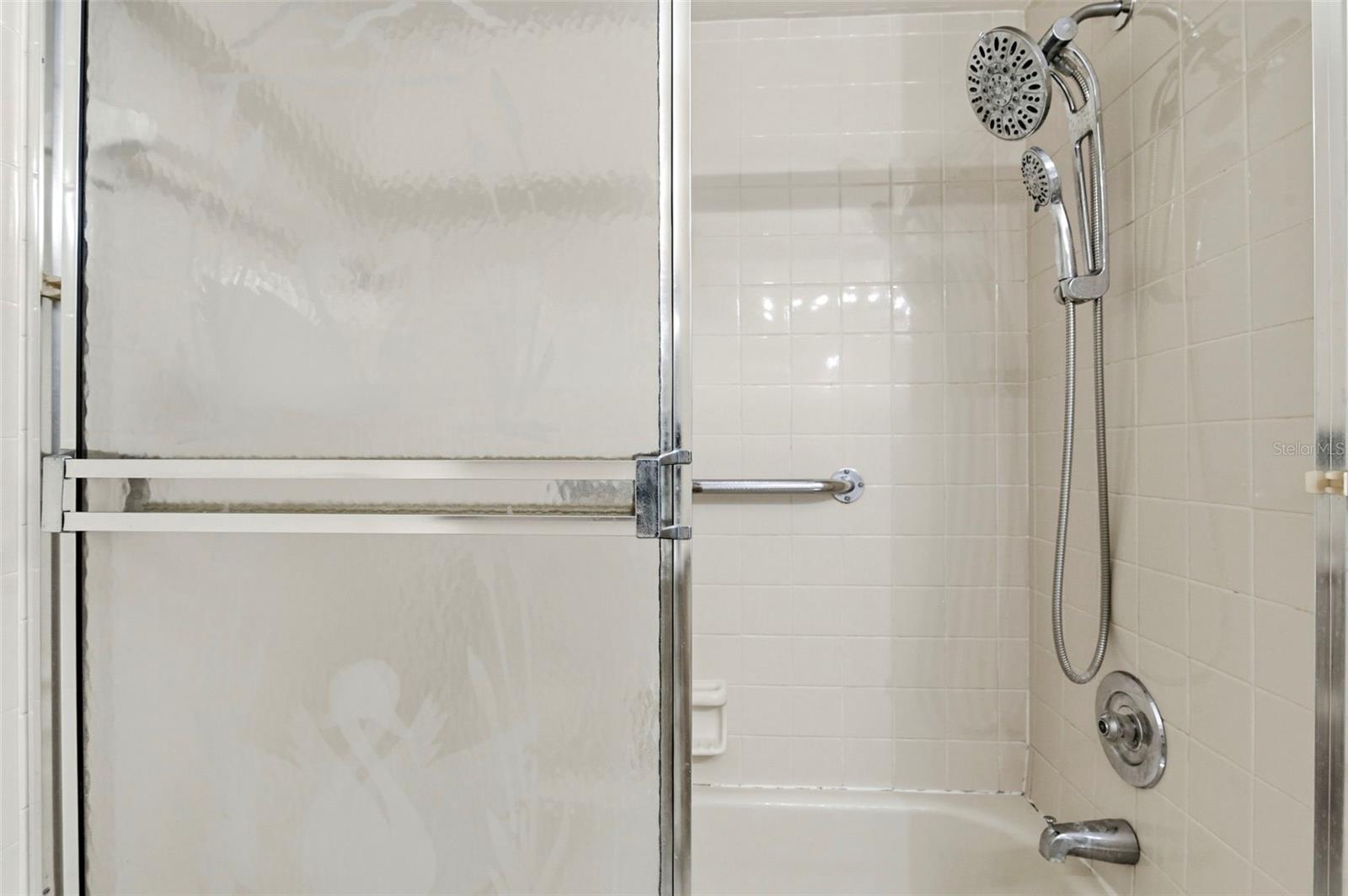 Tub/shower combo with dual rain shower heads.