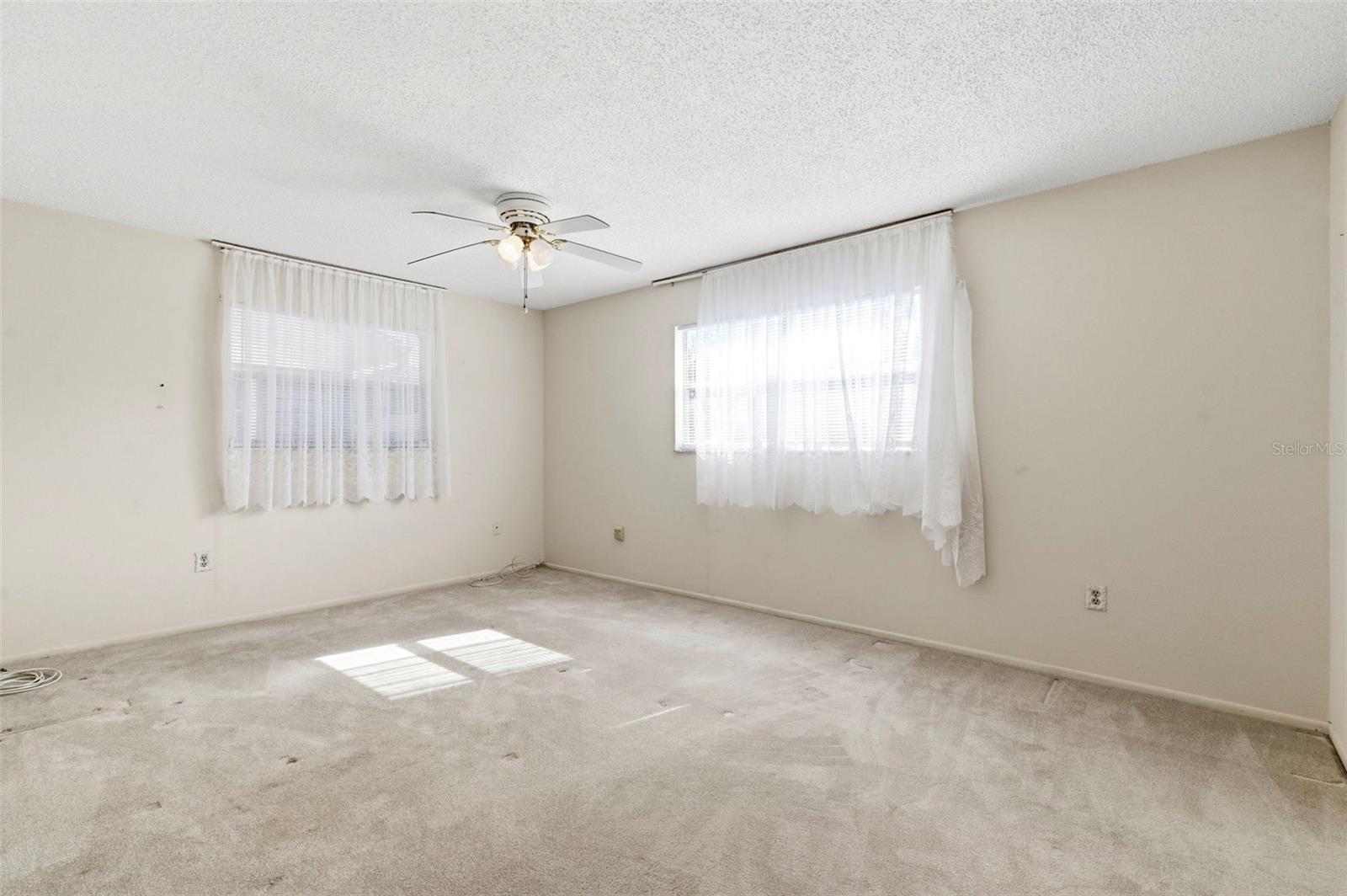 Natural light shines into the second bedroom.