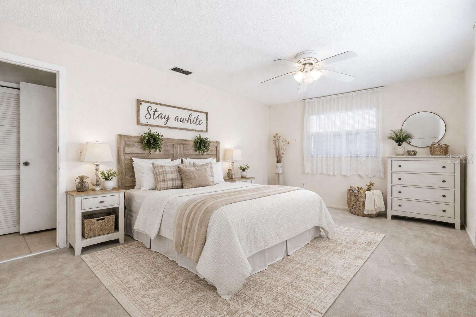 Virtually staged guest bedroom.