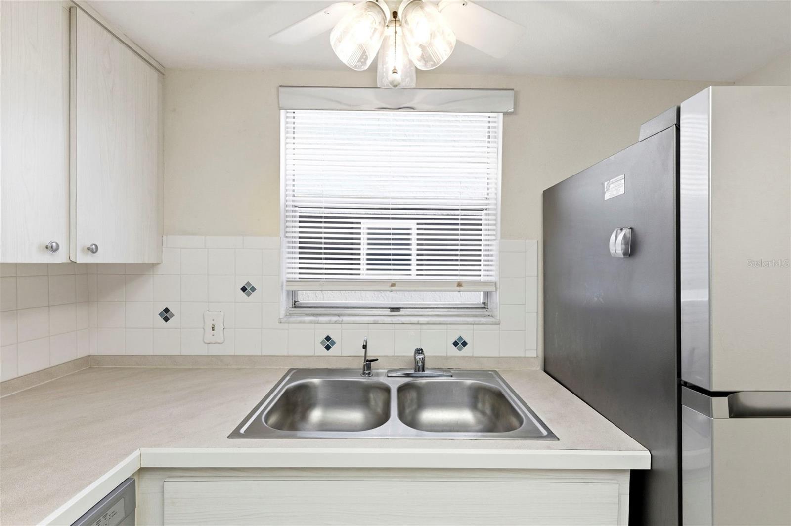 Bright window over the kitchen sink.