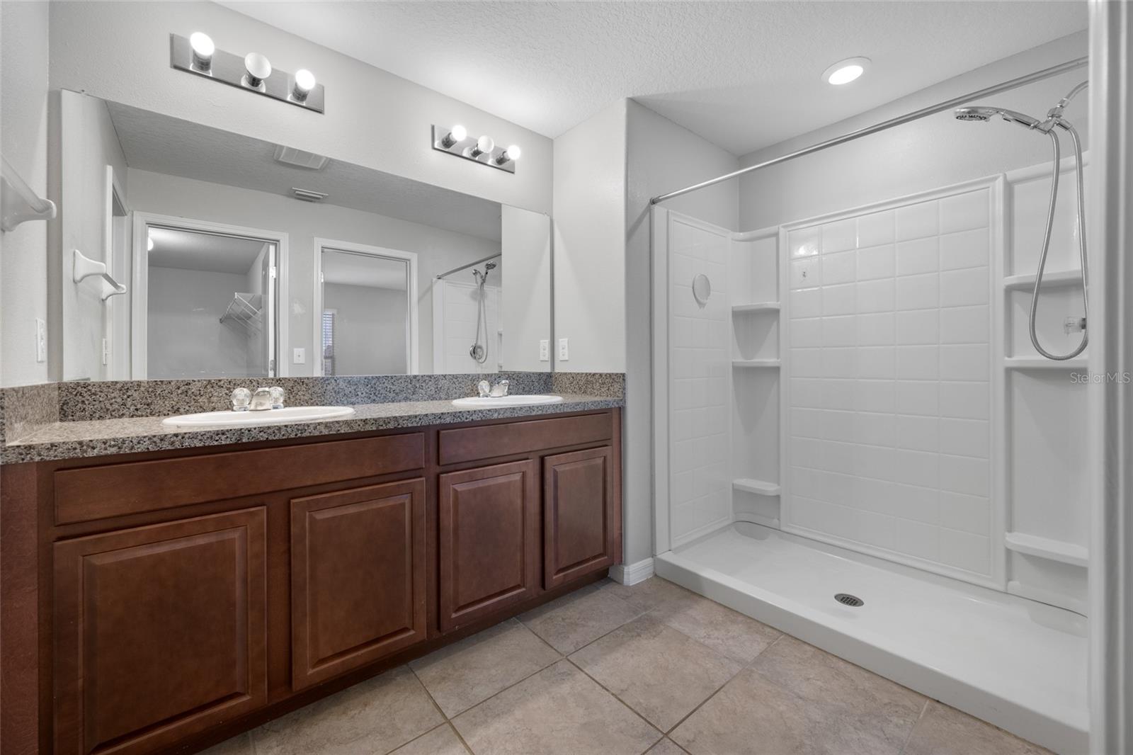 Primary Bathroom with Dual Sinks and a walk in shower