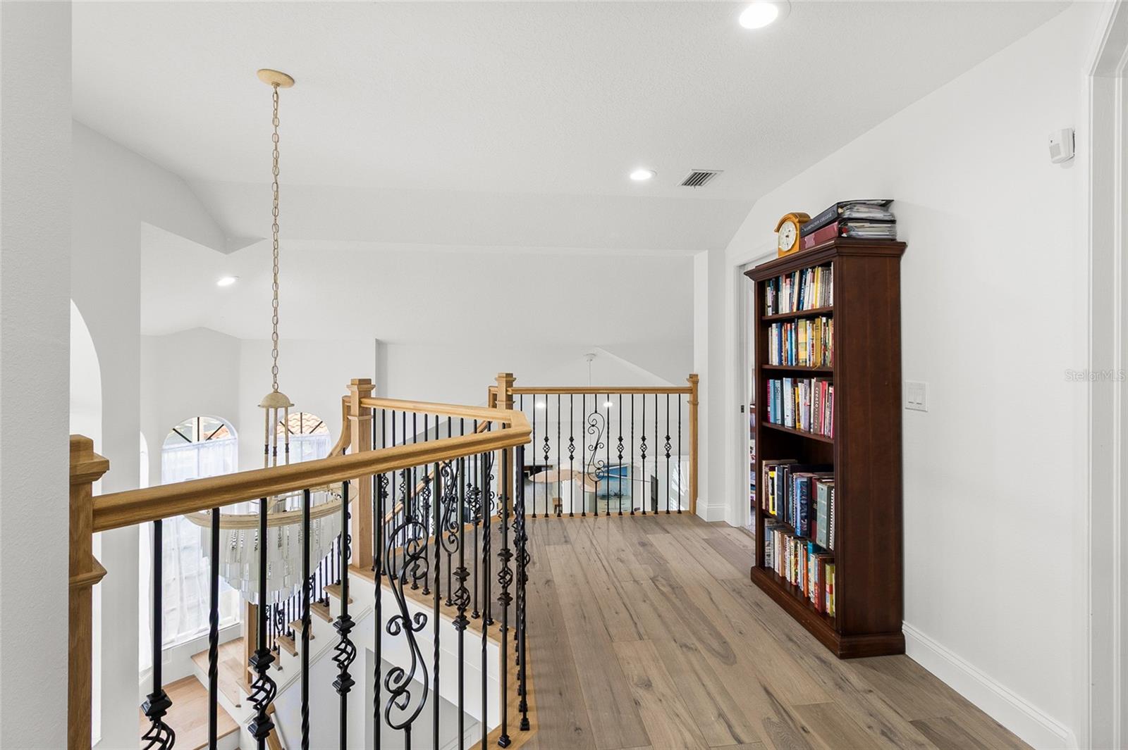 Engineered wood flooring in the upstairs entry and hall