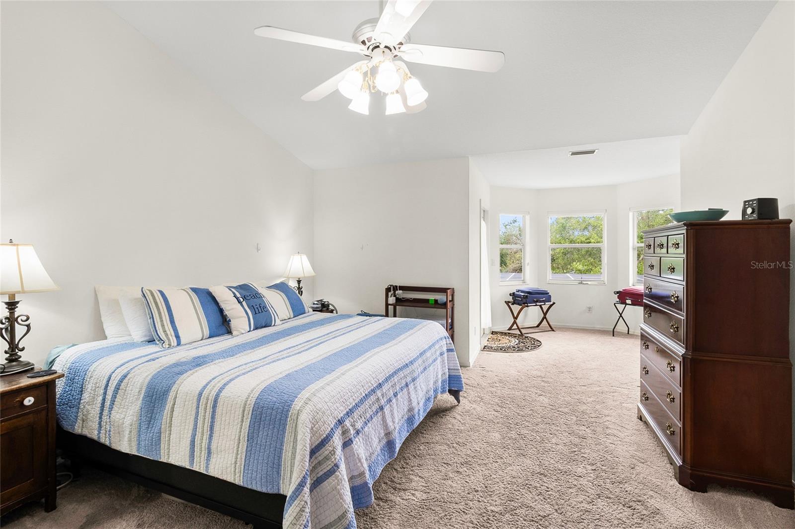 Primary bedroom has plenty of space for king size furniture.