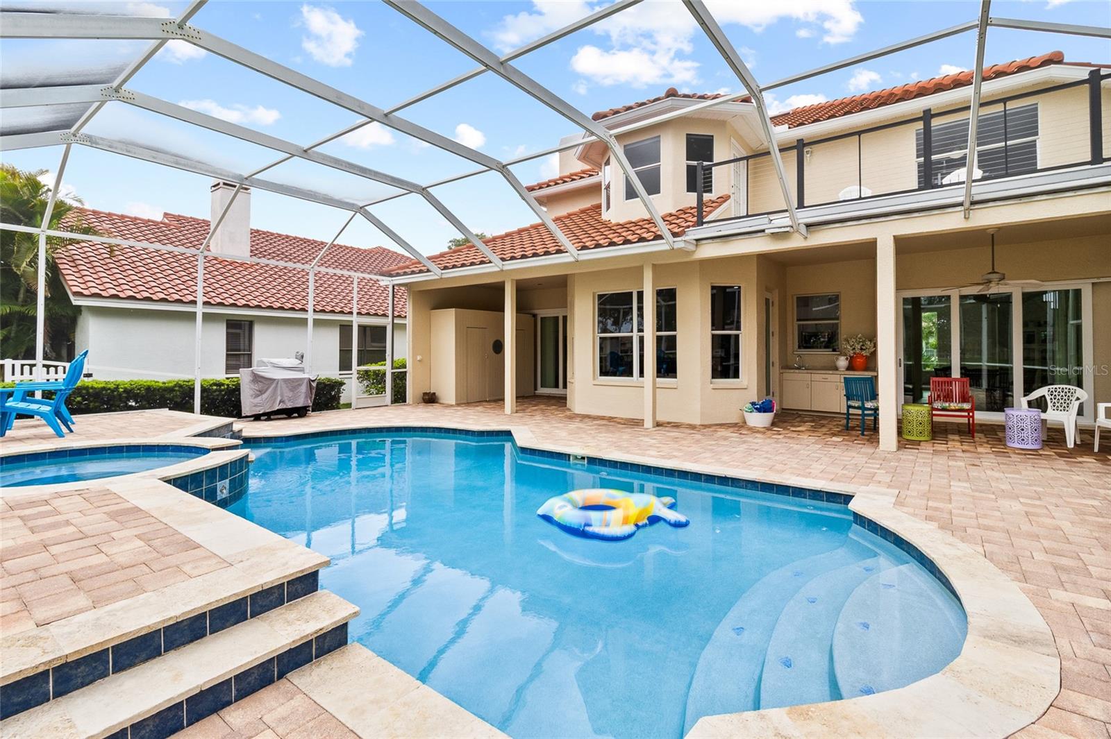 Pool cage is large and airy, recently rescreened