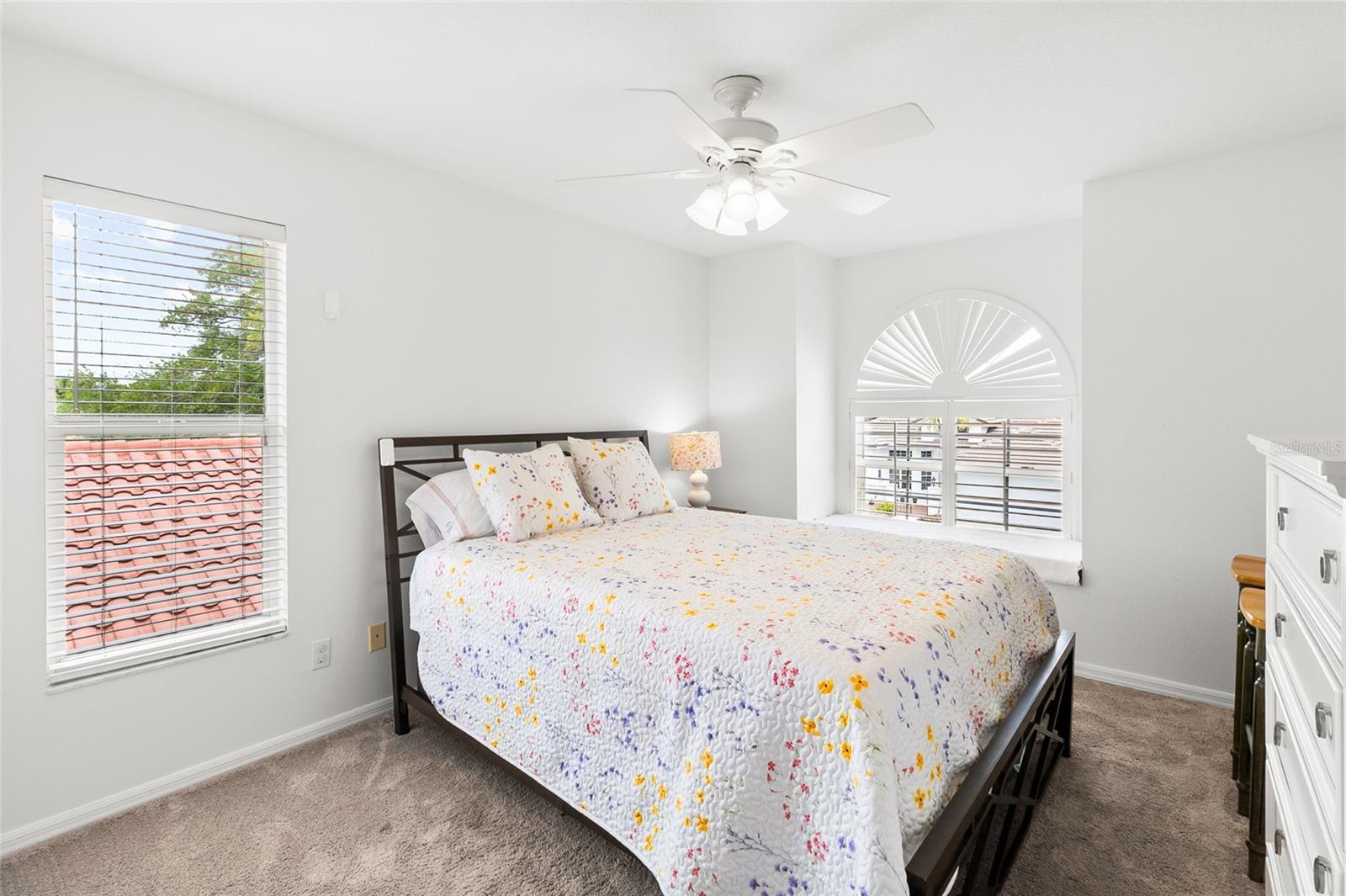Bedroom #2 with window seat and plantations shutters