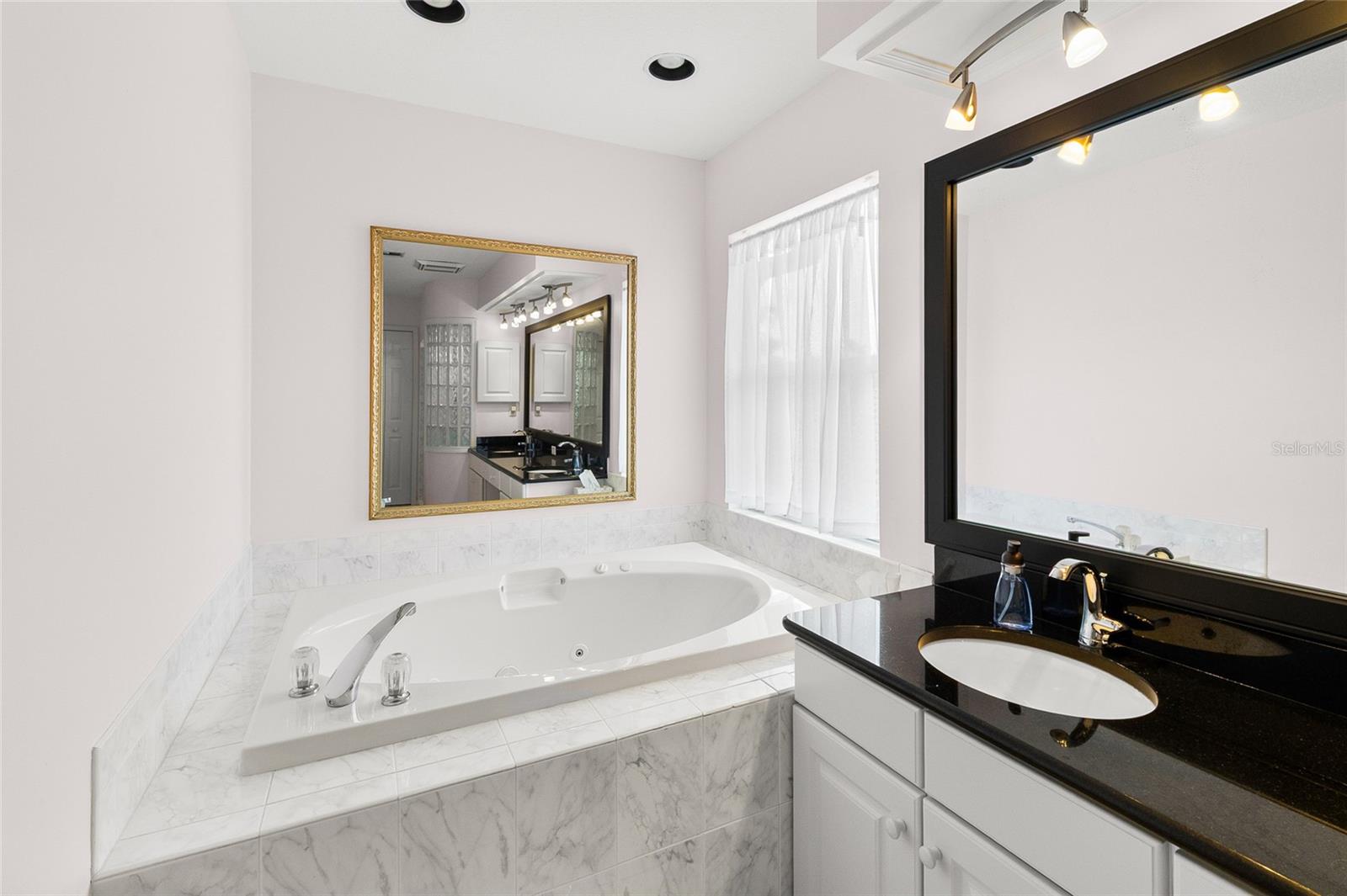 Jetted tub has step, easy to enter and exit