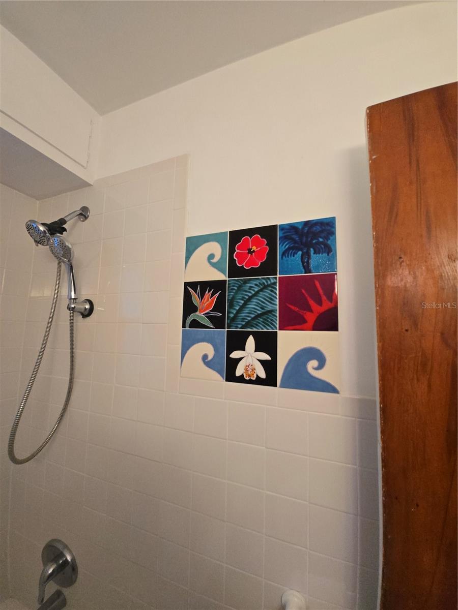 Local Gulfport artist is owner. Touches of her handmade tiles though out home.  Inside and out