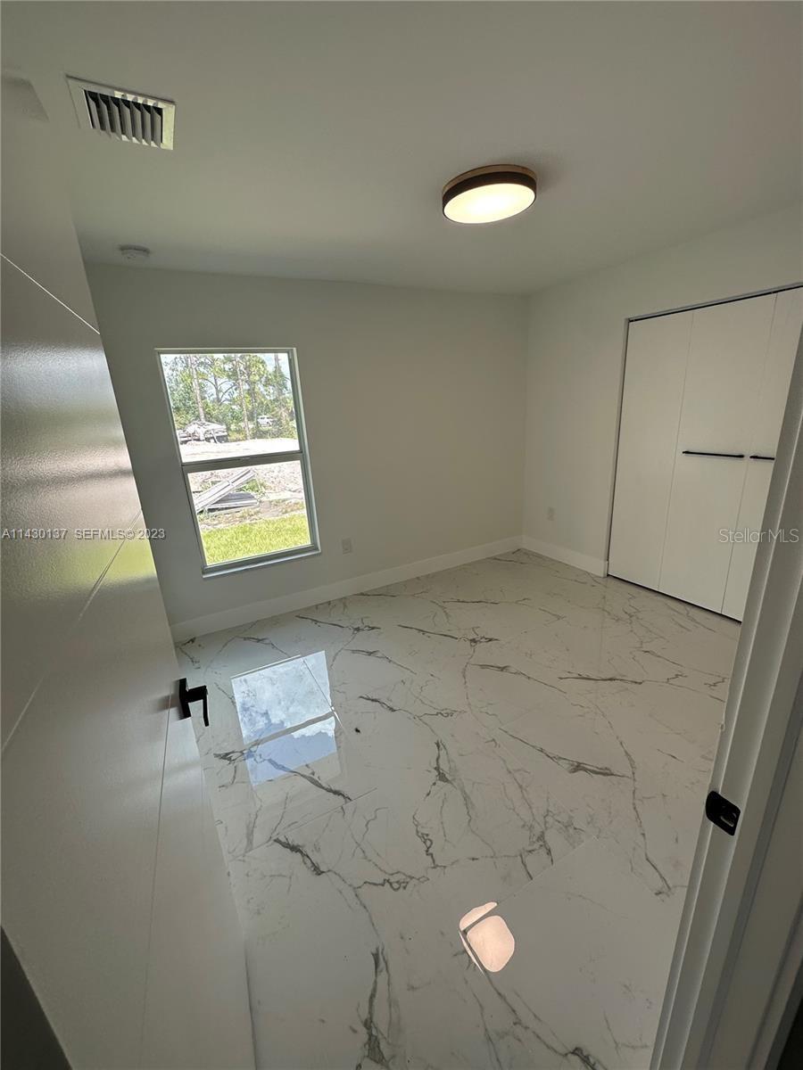 1125 MILWAUKEE BLVD, LEHIGH ACRES, FL, 33974