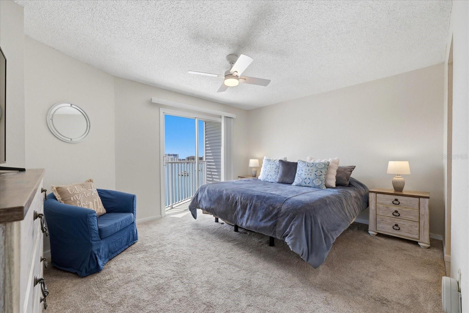 Primary bedroom with its own balcony