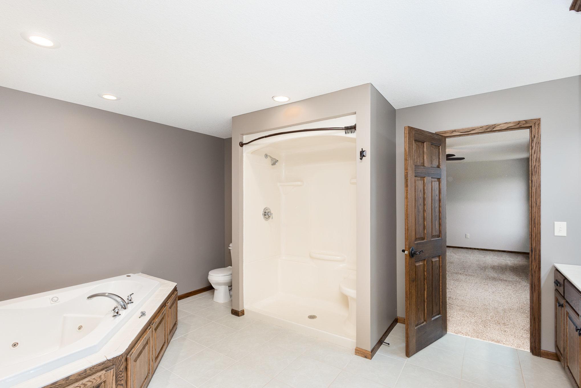 Primary bedroom suite with jetted tub and seperate shower